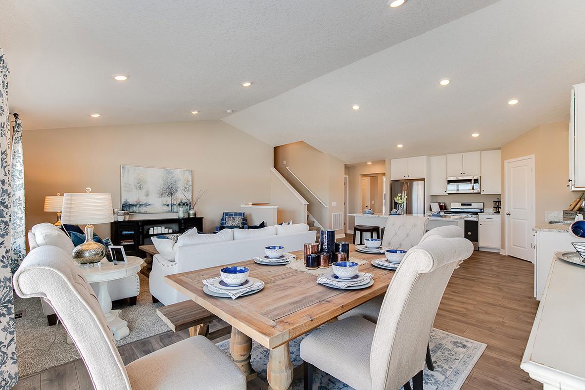 Spacious and well-lit dining area just off of the kitchen! Model home photo, colors and selections may vary.