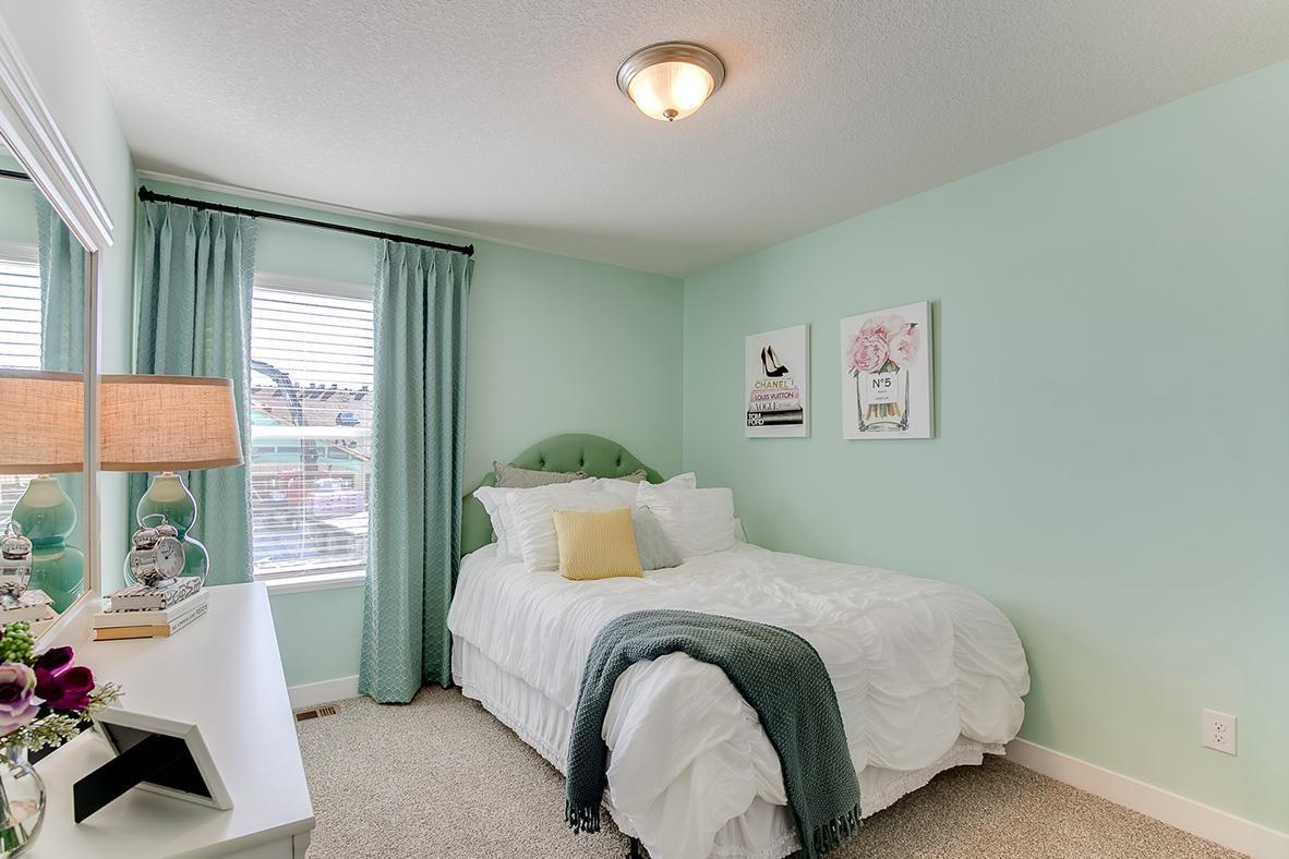 Space is also abundant throughout the rest of the home's upper level bedrooms. Model home photo, colors and selections may vary.