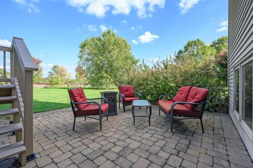 The paver patio that overlooks the one acre space is perfect for family time or festive gatherings.