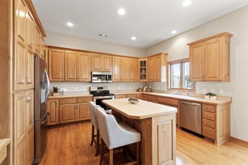 Stainless appliances, center island, abundance of recessed lighting, quality cabinetry and a picture perfect kitchen window so you can watch the kids at play.