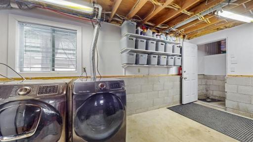 Lower level laundry, storage with access to the garage.