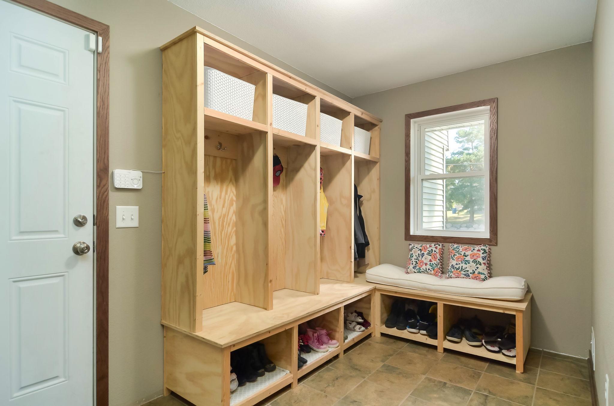Custom built cabinets keep the mud room organized.