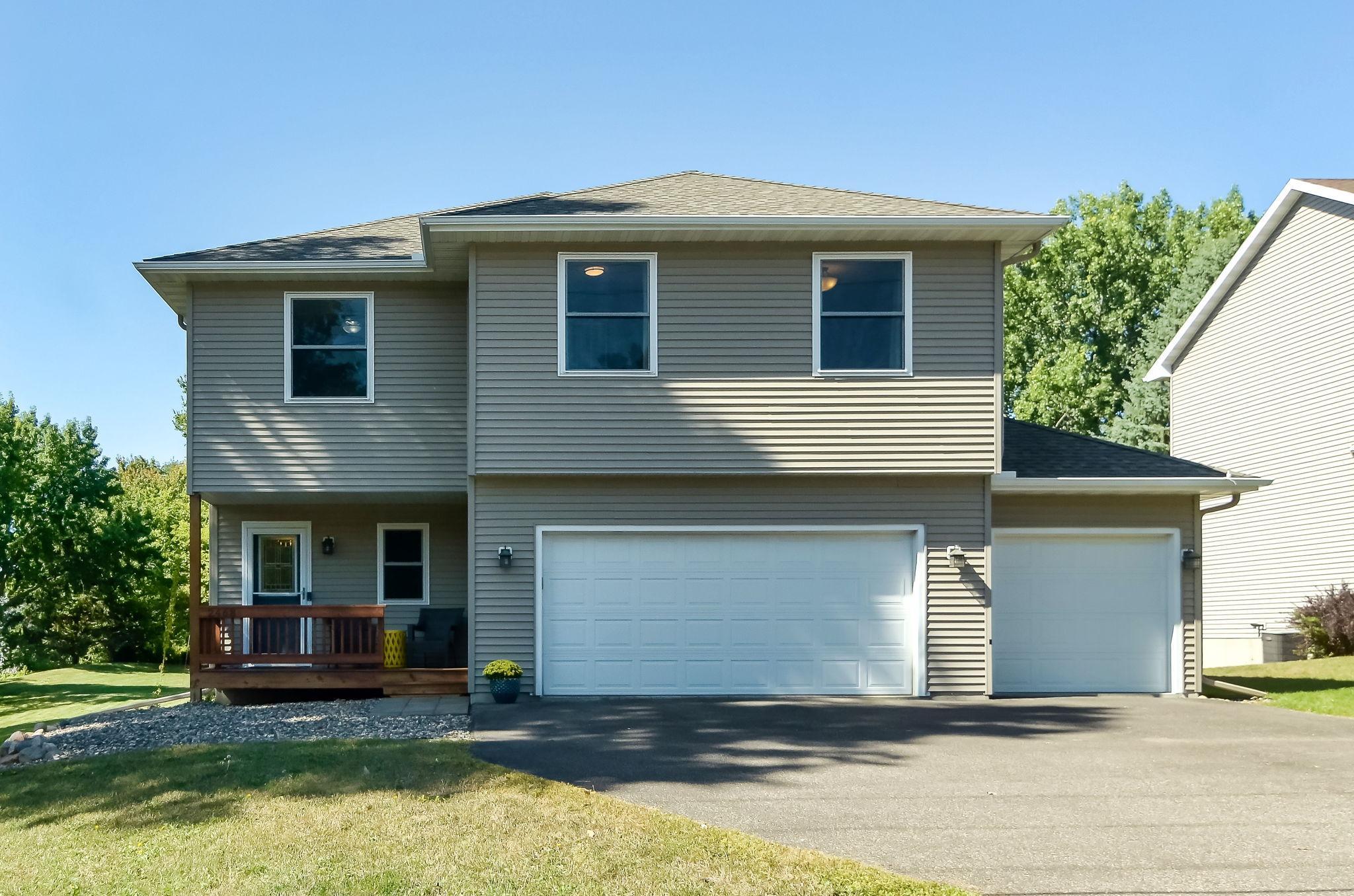Photo for 2468 Tower Drive, Woodbury, MN 55125 - Listing #6433550 Three car garage and plenty of space for guests to park in the wide driveway.
