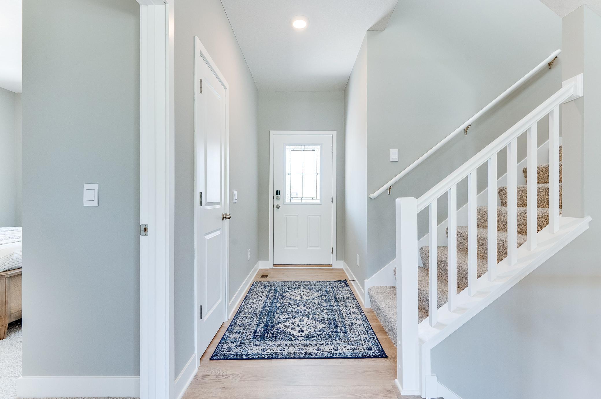 The abundance of natural light provides a warm welcome! Photo of model home, color and options will vary.