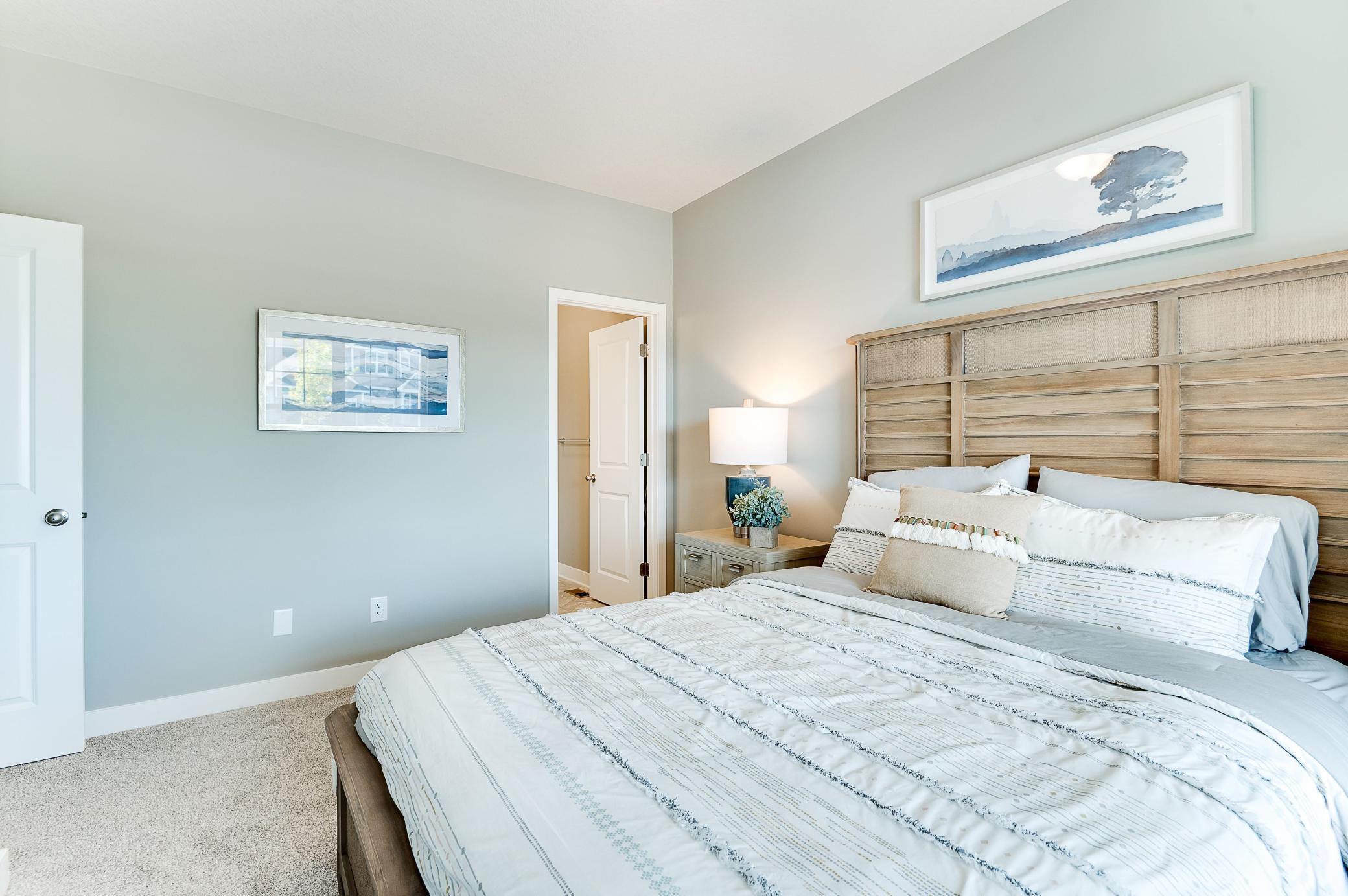 A guest room or perhaps the main level room with ensuite bath would be ideal for a home office. Photo of model home, color and options will vary.