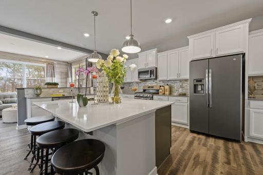 It is simply impossible not to fall in love with this home. The open floor plan, morning room off the kitchen, over-sized kitchen island, numerous cabinets, windows, finishes....need I say more?