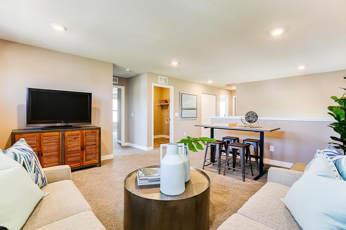 Once upstairs, the entire level flows from the focal point offered by this loft space. Sure to become a family favorite hangout spots! Photo of model home, color and options will vary.