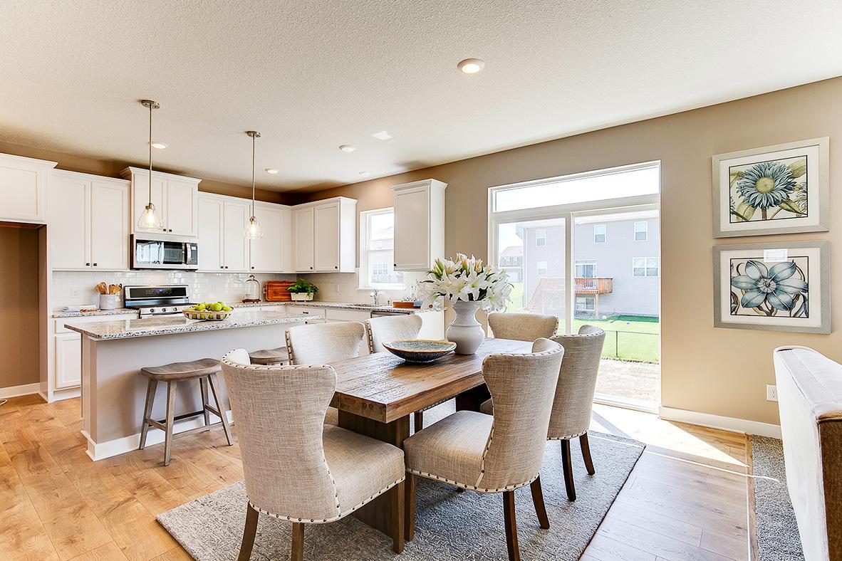 Stunning cabinetry throughout the home, granite counter tops, subway tile backsplash, stainless steel appliances and more! Photo of model home, color and options will vary.