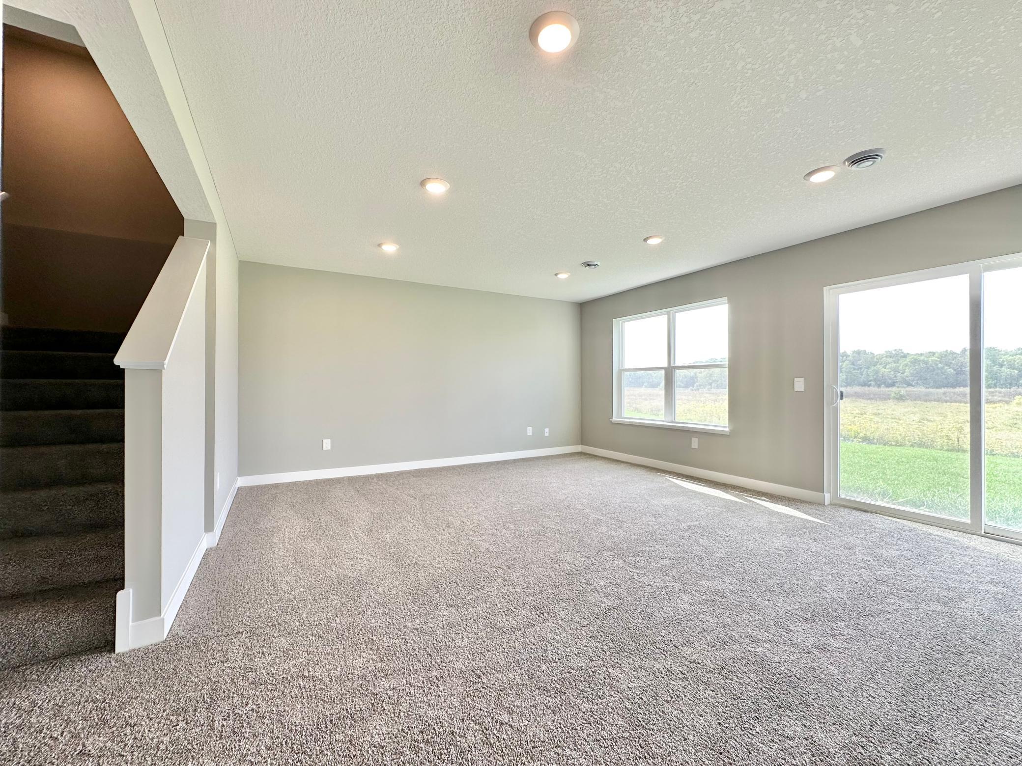 Finished Lower Level Family Room. Photo of Bridgewater II Adams home for sale at 3165 Sunshine Curve in Prior Lake!