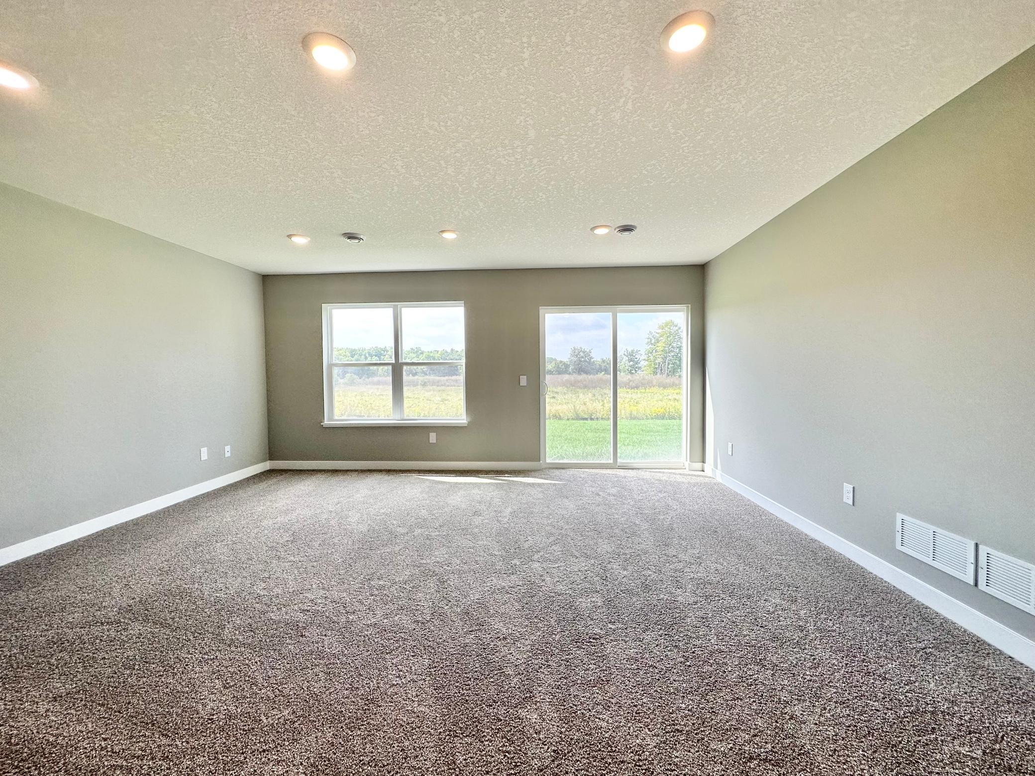 Finished Lower Level Family Room. Photo of Bridgewater II Adams home for sale at 3165 Sunshine Curve in Prior Lake!