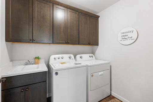 Main floor Laundry Room with wall to wall cabinets