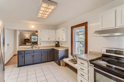 Freshly painted walls and refaced cabinets compliment the original character of the home.