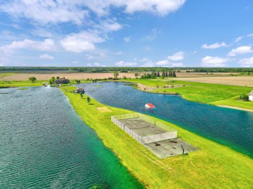 Walk the footbridge to the tennis and basketball courts.