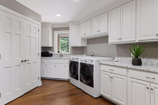 Storage galore in this extra large, bright laundry/mudroom!