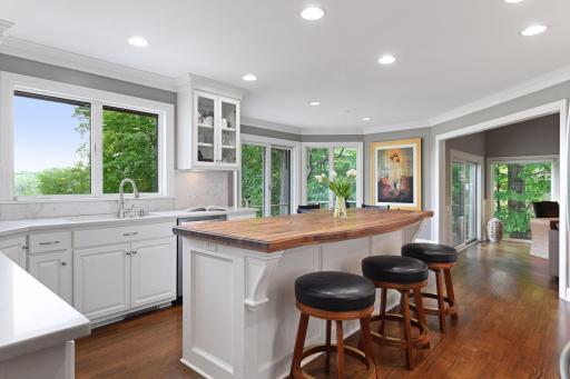 The extra large island boasts a custom, black walnut, countertop that is the focal point of the kitchen.