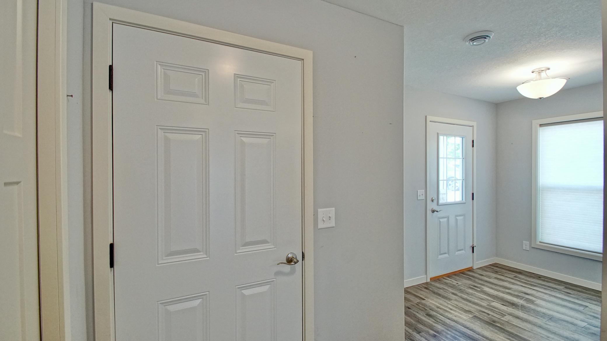 Door on the left opens to the attached, insulated 2 car Garage - Foyer and Front Entry to the right