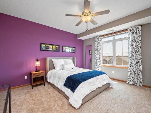 Spacious owner's suite is bright and cheery with natural light.
