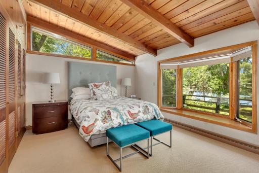 Main bedroom with bay window providing beautiful river views, an abundance of storage and updated, full master bath.