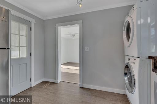 A stacked washer and dryer come with the home.