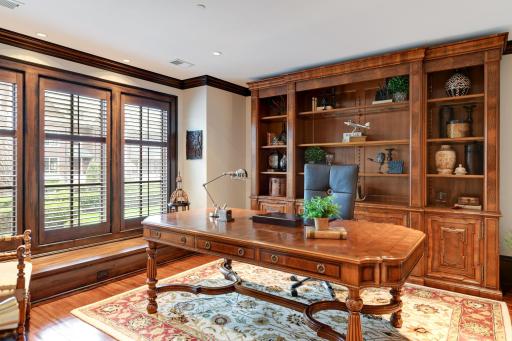 Enjoy a well appointed main floor office, library, den - window seat, custom shutters ... views to the courtyard