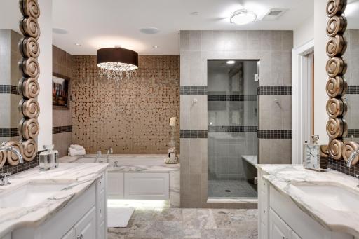 Luxurious owner's bath ... separate vanities, shower, tub,