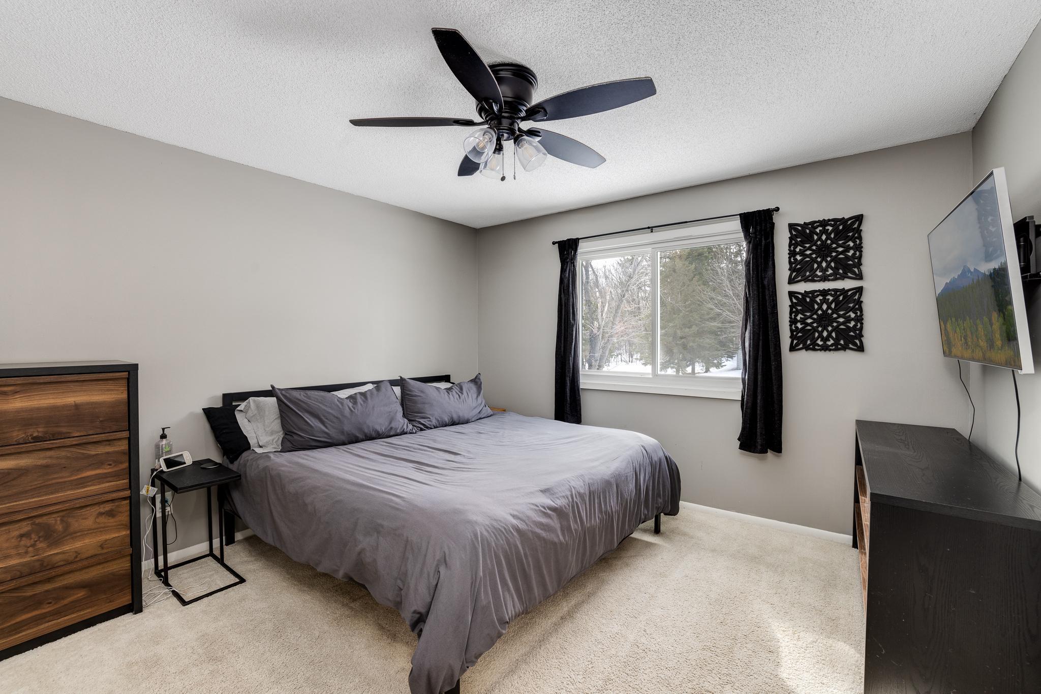 Very nice primary bedroom that overlooks the backyard and room for that king size bed!