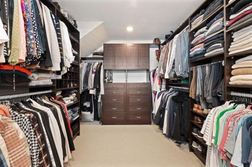 Huge walk-in closet with custom closet system.