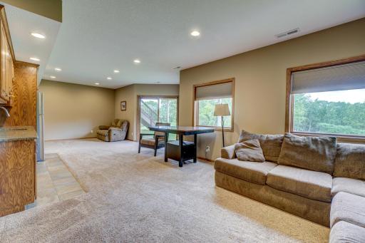 Lower level features in-floor heating, a wet bar area, and walkout to the backyard!