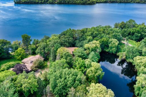 Drone view of 16A Buffalo Road on PLEASANT LAKE and with Pond along side. Very private and densely wooded site.