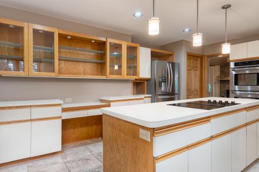 Abundant Cabinets, Island, and Planning Desk. Note: Stainless Steel appliances.