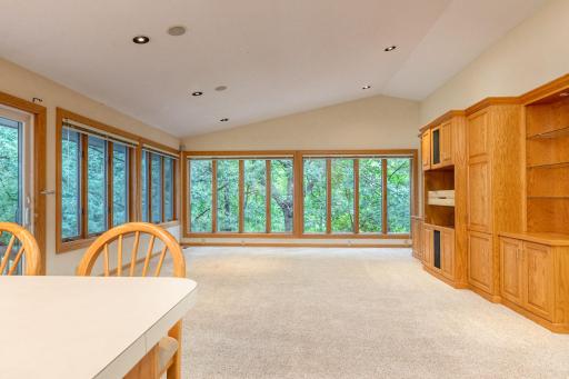 From the Kitchen, this view is into the vaulted main floor Family Room with built-ins.