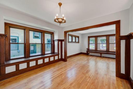 The formal dining room is connected to the living room with a wide arch, giving both spaces a separate but open feel.