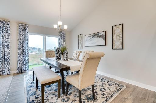 Another highlight to the home, the dining space is over 15-feet deep and coated in the same hard surface flooring that covers most of the main level. Photo of model, colors and options will vary.
