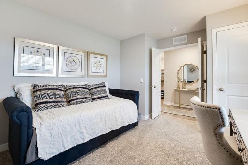 In addition to the vast living spaces on the main level, open the double doors & you are greeted by a bedroom- which can be multi-functional, & serve as a home office too, how will you use this space? Photo of model, colors and options will vary.