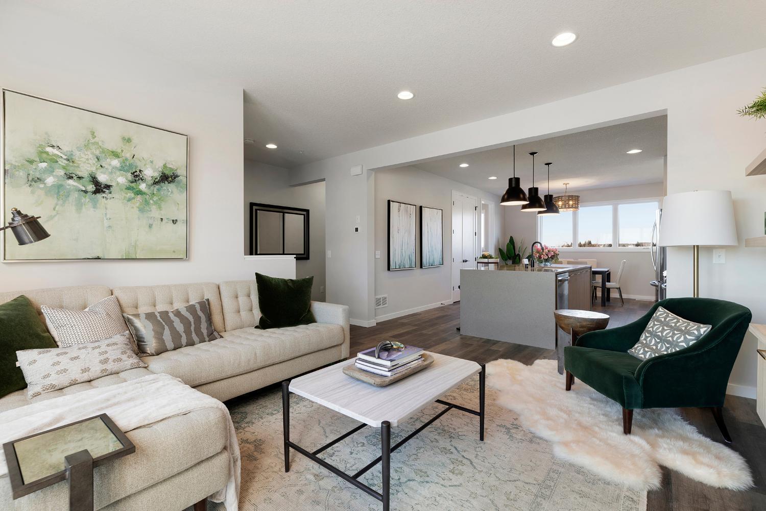 It's just so cozy and perfect! Family room which flows into kitchen makes it so easy for entertaining. Photos are of model home; features and options may vary.