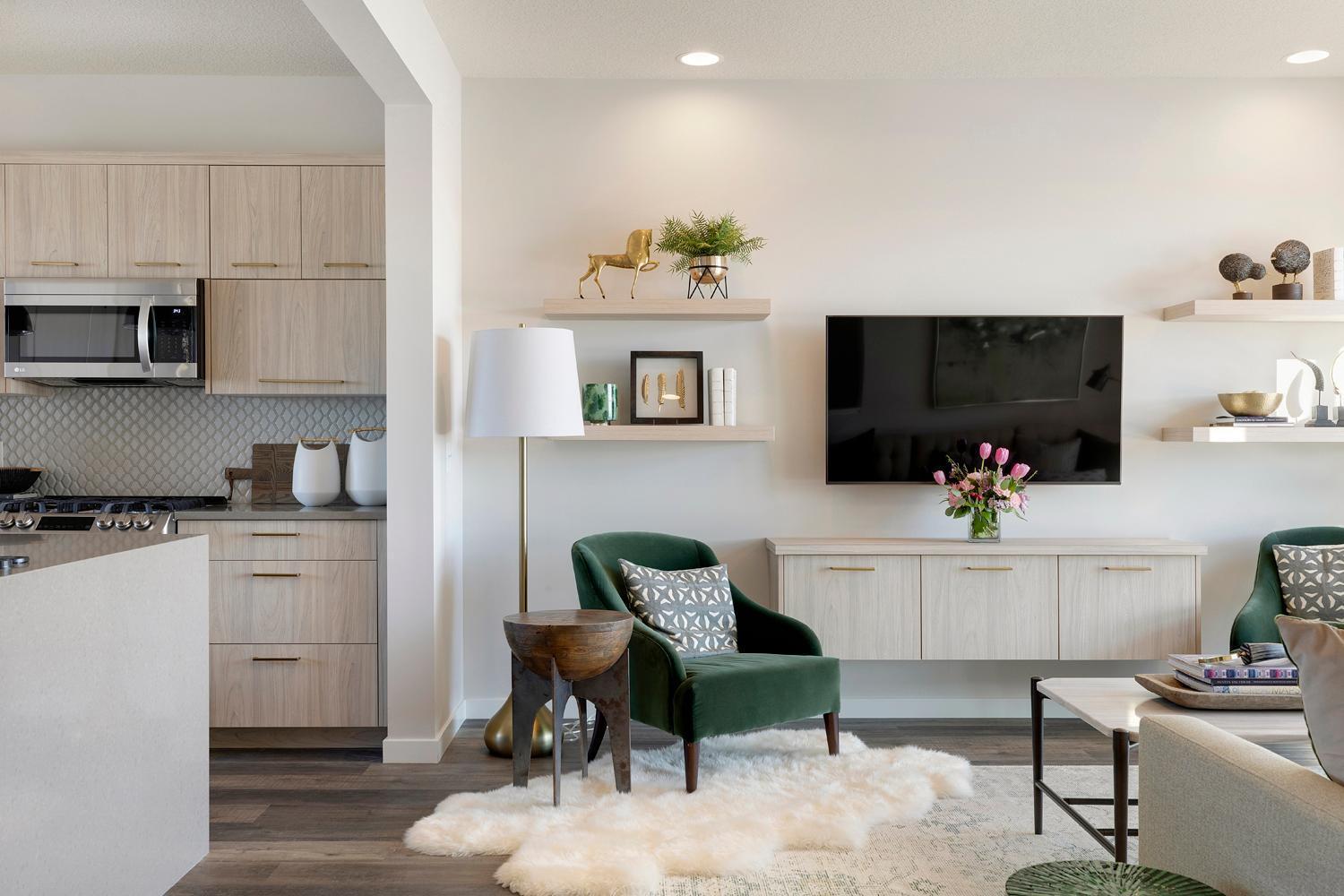 The built-in media cabinet and floating shelves make the perfect place to hang your TV. Photos are of model home; features and options may vary.