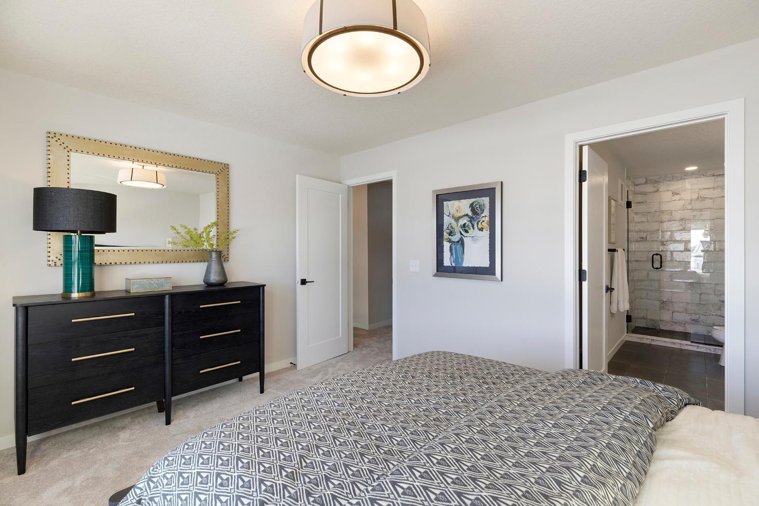 Owner's bedroom with private bath. Photos are of model home; features and options may vary.