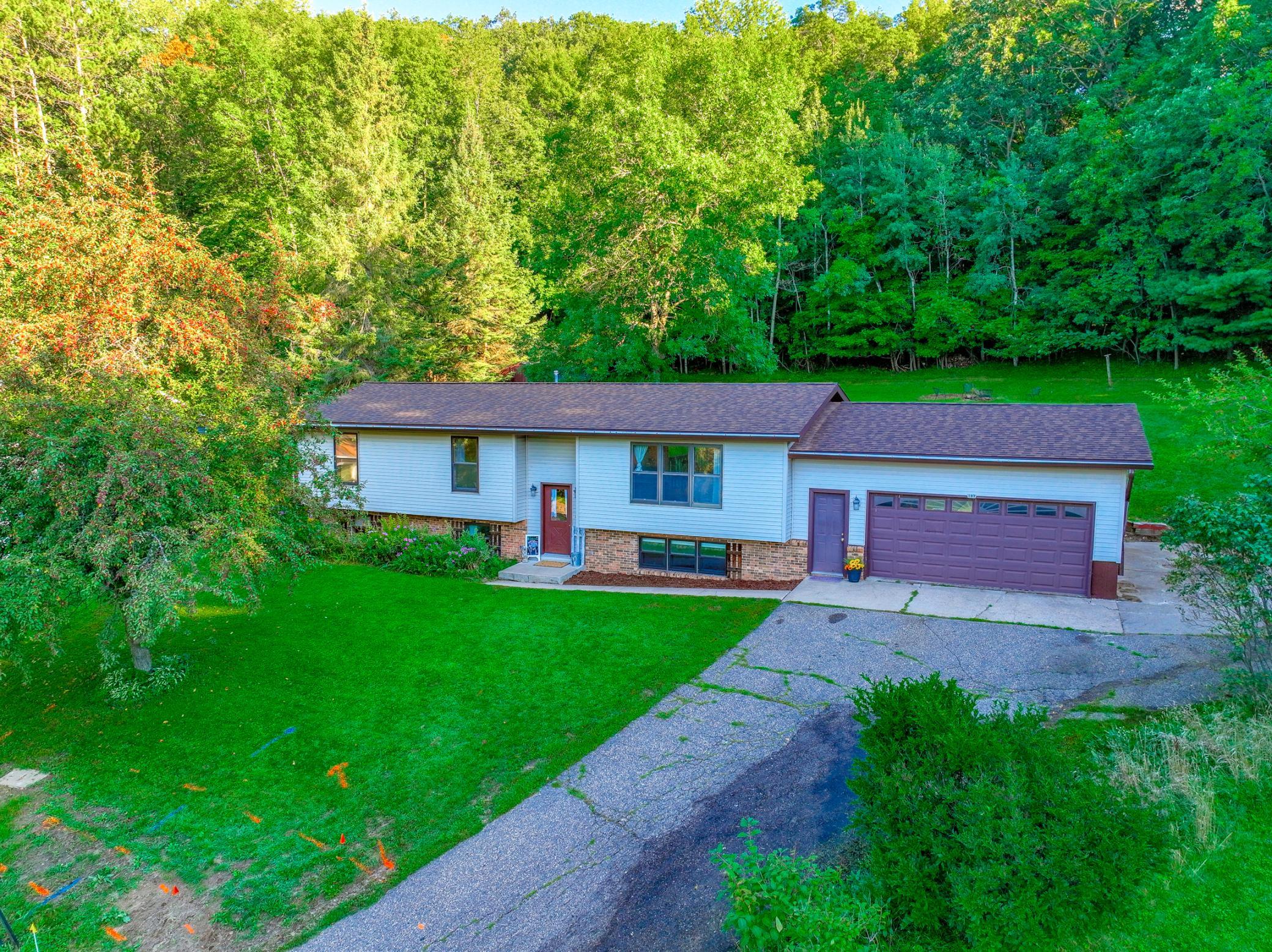 5-bedroom home tucked away on a quiet cul-de-sac with with ample privacy in the backyard with a large deck offering the perfect place to relax and enjoy nature.