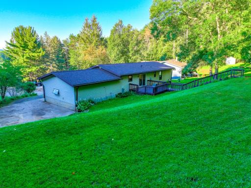 Ample privacy in the backyard with a large deck offering the perfect place to relax and enjoy nature.