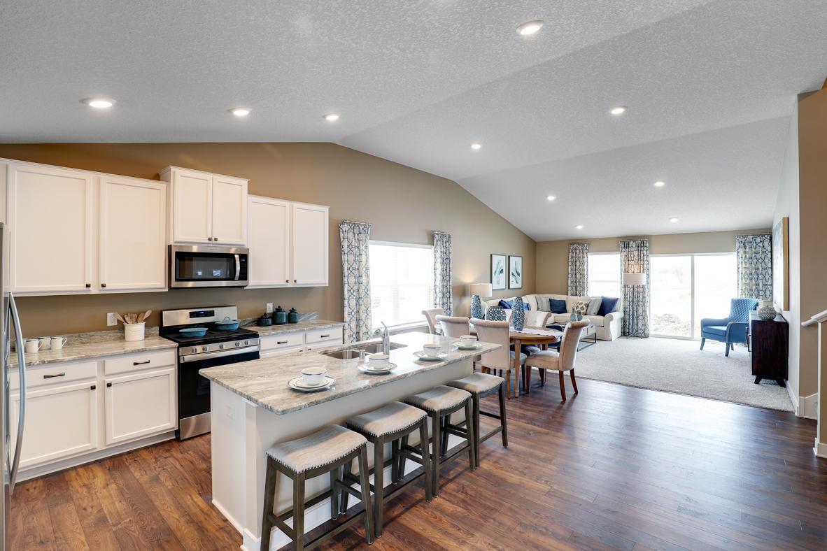 The open-concept home design is epitomized with a layout that flows seamlessly from end to end. Picture is of model home - actual finishes may vary.