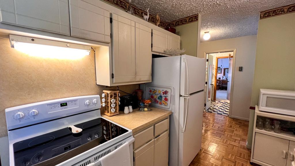 11036 Tall Timbers Rd SW, Garfield, MN 56332 Nice galley kitchen open to living ding room and views of Fish Lake.
