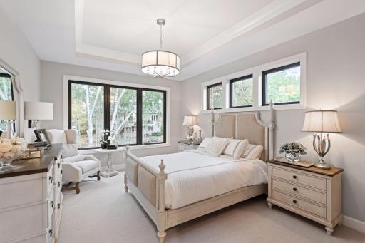 Offering main-level living at its finest, the Master Suite is a tranquil and private retreat. Photos of a similar model.