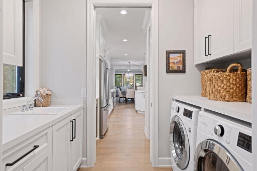 Conveniently located, the Laundry and Mud Room are just off the Garage. Photos of similar model.