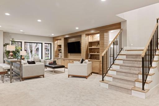 Fully finished, the walk-out lower level enjoys space for a second Family Room. Photos of similar floor plan.