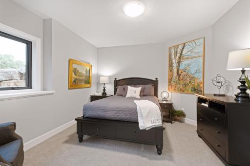 Each of the bedrooms are large and bright. Photos of similar model.
