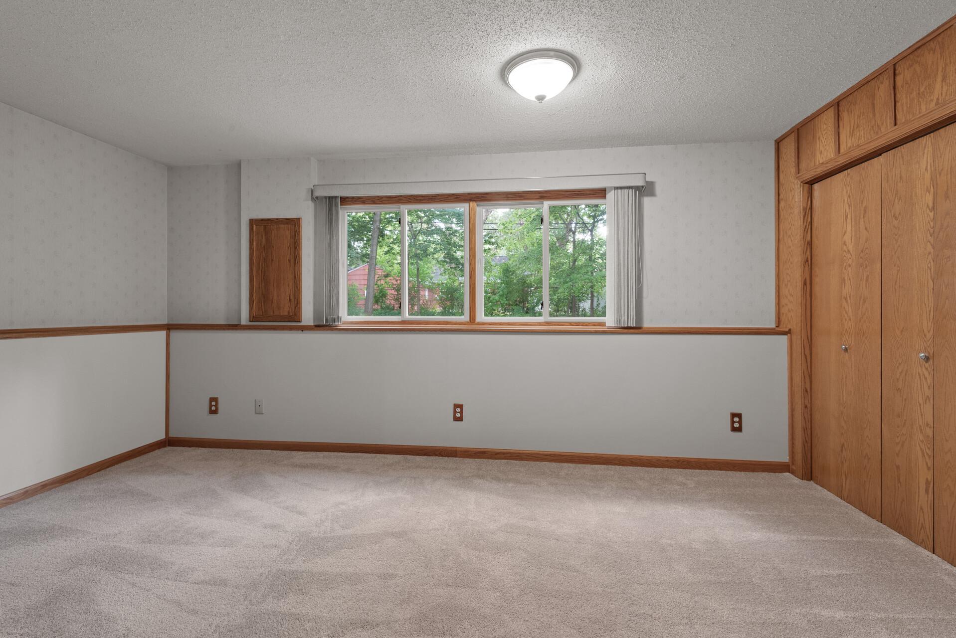 Photo for 5425 Bryant Avenue N, Brooklyn Center, MN 55430 - Listing #6427783 Lower level family room has large windows facing the backyard