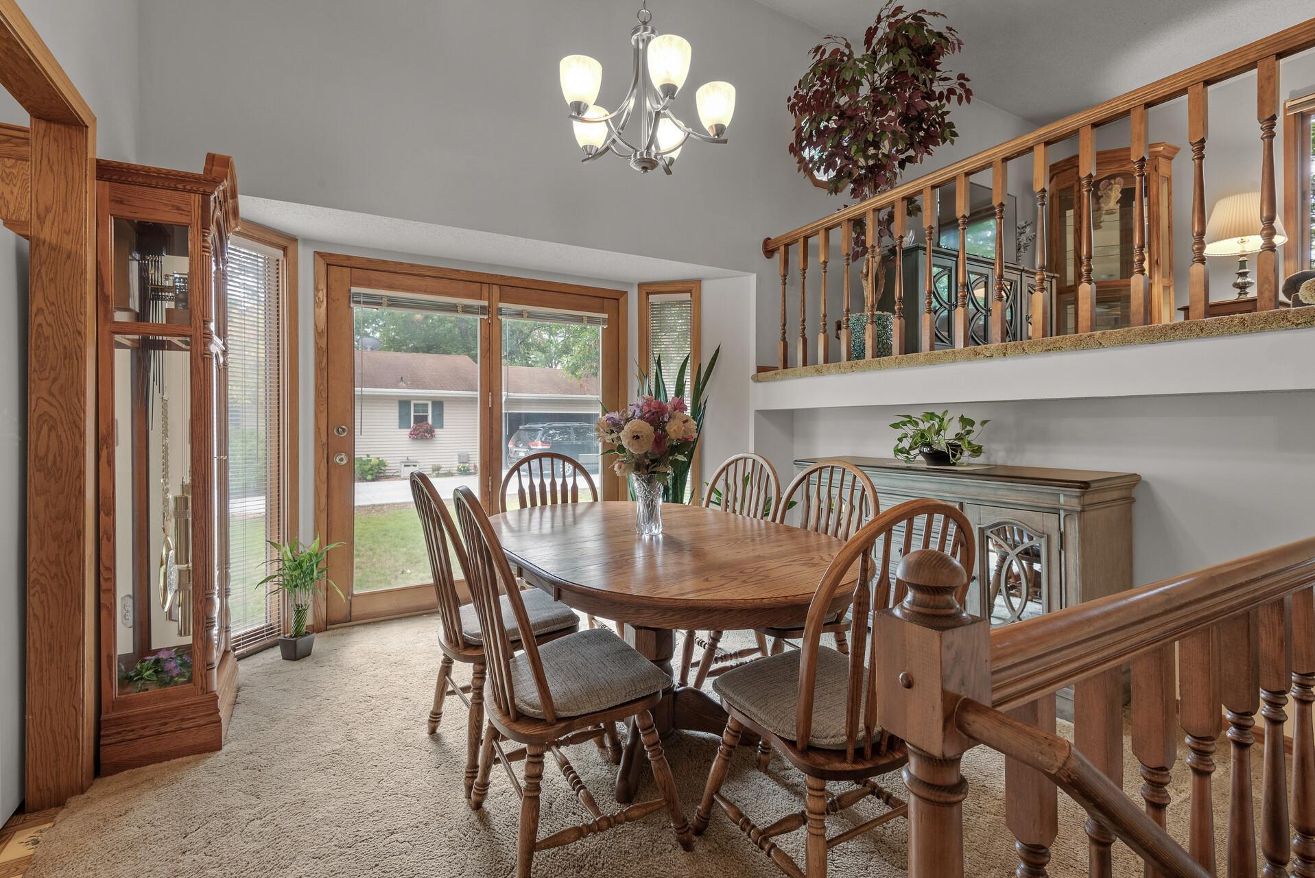 Sliding glass doors in the dining room lead out to the side of the home. Build your own styled deck, or leave as is for a functional access to the yard.