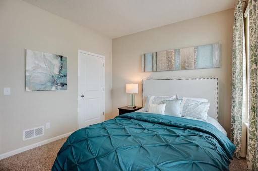 The additional bedroom at the front of the home provides ample space for nearly any arrangement of furniture! *Photo of previous model, selections will vary.