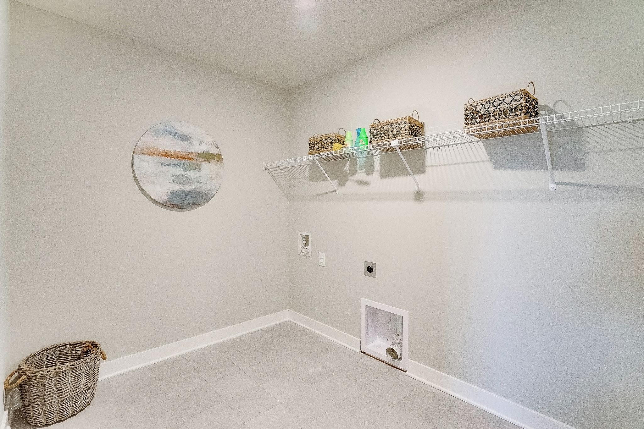 Upstairs laundry ROOM! Space to sort, fold and store! (Model home, colors will vary)