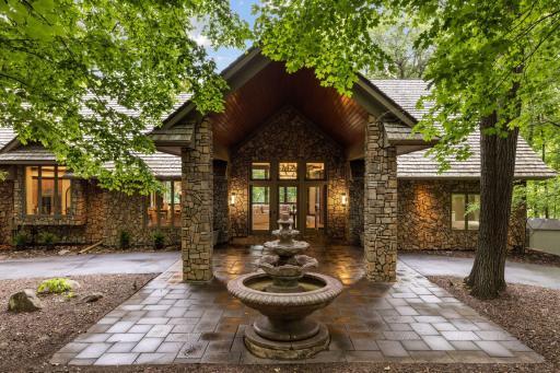A very grand entrance! Welcome to 3600 Northome situated on over 2 acres of woods!